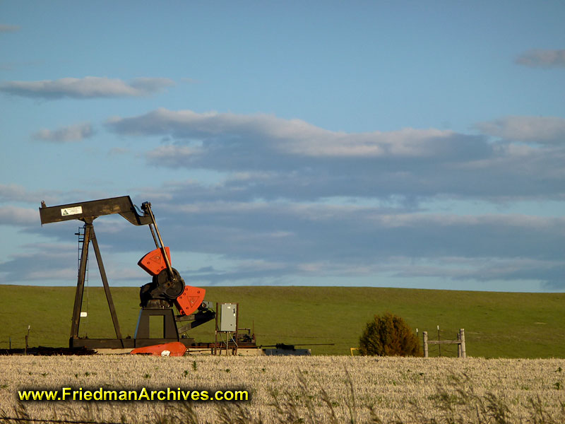 oil pump,petrolium,pump,field,energy,orange,green,clouds,fossile fuel,